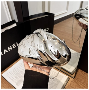 Chic silver mirror-finish heart evening bag with detachable chain strap and metallic glow