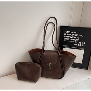 Deep brown faux leather tote set with matching pouch and vertical metal clasp detail
