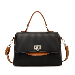 Chic black vertical stripe handbag with brown contrast straps and silver metal twist lock