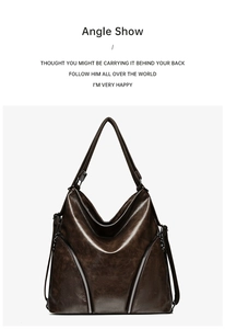 Close-up of vintage brown large tote bag with silver zippers and glossy texture