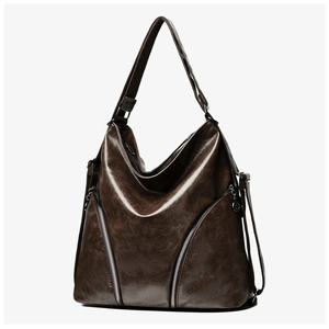 Macro detail of dark brown retro crossbody bag featuring vintage faux leather texture