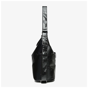 Close-up of black textured large capacity shoulder bag with silver adjustable metal buckle