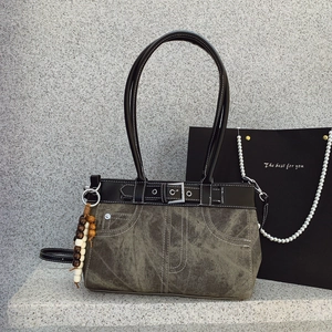 Retro canvas shoulder bag in grey-green with leather trim and wooden bead charm accessory