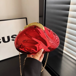 Fashionable red mirror acrylic evening bag with fluid metal texture and gold chain strap