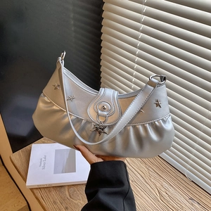 Silver pleated underarm bag with metallic star studs and a minimalist Korean design