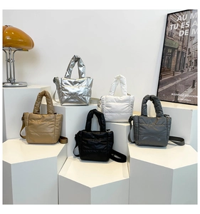 Quilted puffer handbags in silver, white, khaki, black, and grey with shoulder straps