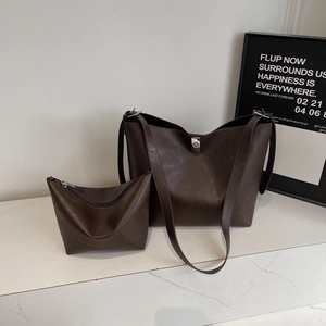 Dark brown faux leather tote bag and pouch set with wide shoulder strap for commuting
