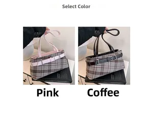Detail view of retro plaid Boston bag in pink and brown with faux leather belt straps