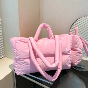Chic glossy pink quilted puffer handbag with padded top handle and 2025 minimalist style
