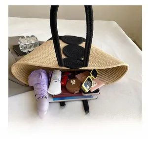 Detailed interior of a beige hand-woven tote bag showing its large capacity for daily essentials