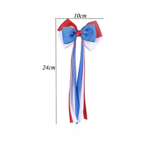 Detail of US flag themed grosgrain bow hair clip with measurements 10x24cm and long ribbon