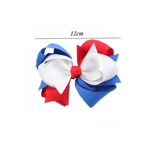 Detail showing 12cm multi-layer patriotic bow hair clip with red white and blue ribbons
