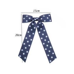 Size details of a navy blue star pattern hair bow with long ribbons, 13cm by 20cm