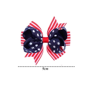 Detail showing a 9cm US flag style bow hair clip made of durable grosgrain ribbon