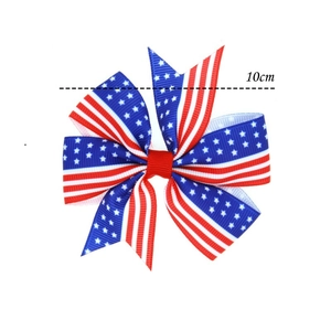 Detail view of 10cm US flag bow hair clip with red white and blue star pattern