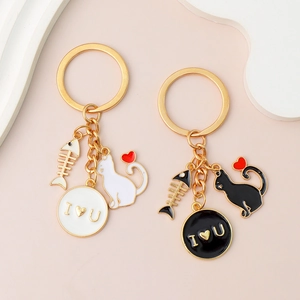 Cartoon black and white cat keychains with heart balloon and fishbone charms