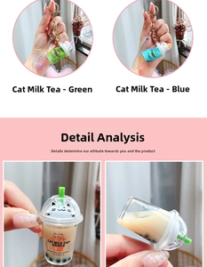 Close-up of cat-shaped boba tea keychain with liquid quicksand and pearl details