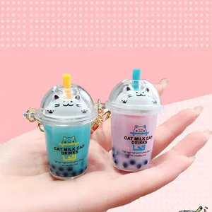 Creative cat milk tea cup keychains in blue and purple with golden metal chains