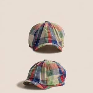 Classic checkered beret for children with colorful plaid pattern in green and blue