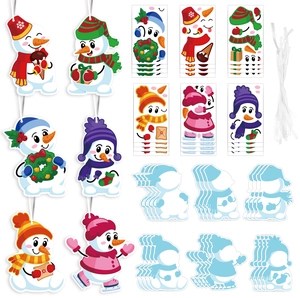 DIY Christmas snowman sticker craft kit with colorful accessories and hanging ropes