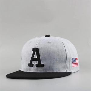 Detail view of the embroidered letter A and US flag patch on a gray snapback hat