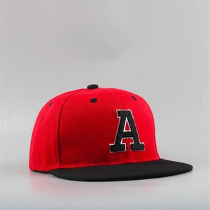 Detail of 3D embroidered letter A on a red and black flat brim snapback baseball cap