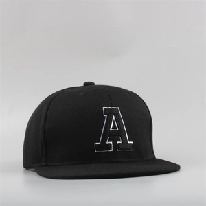 Detailed close-up of 3D embroidered letter A on a black flat brim hip-hop baseball cap