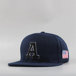 Detail of navy blue snapback hat with white embroidered letter A and USA flag patch