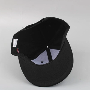 Detail view of the black baseball cap interior showing white support mesh and sweatband