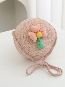Pink round straw woven shoulder bag for girls with decorative fabric flower detail