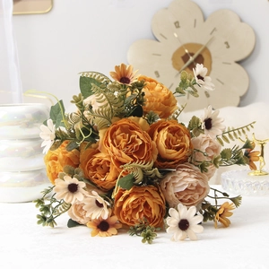 Close-up of elegant artificial peony and rose bouquet with realistic petals and leaves