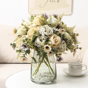 Close-up of vintage peony bouquet with daisies in a glass vase for home decor