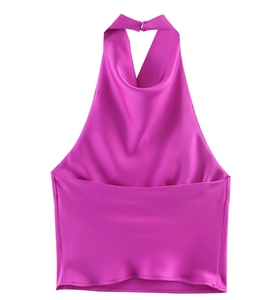Macro detail of magenta satin halter top with elegant draped neck and silky texture