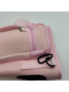 Detailed side view of light pink water bottle pouch with dual zippers and carabiner