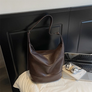 Large dark brown hobo shoulder bag in matte faux leather with wide strap and zip closure