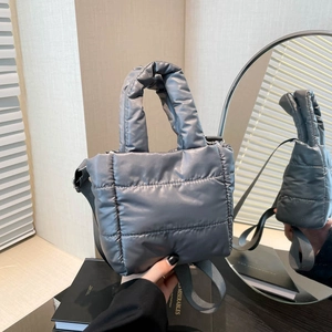 Quilted puffer handbag in dark grey satin finish with padded handle and crossbody strap