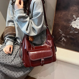 Retro deep red glossy leather shoulder bag with front flap pocket and bear pendant