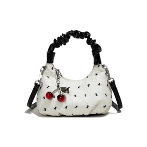 White baguette bag with black rabbit print, pleated handle, and red cherry charm