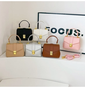 Litchi texture leather handbags collection showing gold twist locks and shoulder straps