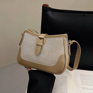 Retro khaki leather and canvas patchwork shoulder bag with gold buckle detail