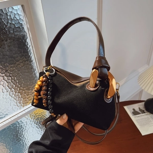 Retro black matte suede and brown leather Boston bag with gold ring buckle and beads