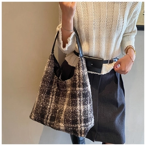 Plaid wool tote bag styled with white sweater for a warm autumn and winter aesthetic