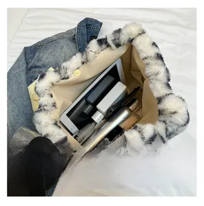 Close-up of leopard print plush bag interior showing large capacity for essentials