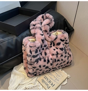 Close-up of pink leopard faux fur tote bag showing soft plush texture and wide handle