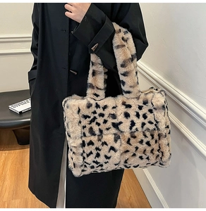 Close-up of leopard print plush tote bag showing soft faux fur texture and large capacity