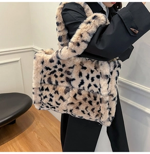 Detailed close-up of leopard print faux fur tote bag with quilted plush texture