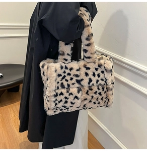 Close-up of leopard print faux fur tote bag with wide shoulder strap and fabric lining