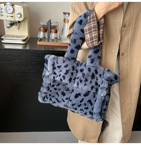 Detail of blue leopard print faux fur tote bag with wide woven texture and plush feel