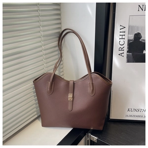 Brown lychee leather tote bag with gold twist-lock and slim shoulder straps