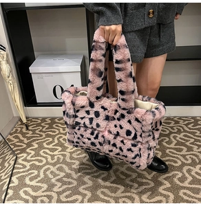 Close-up of fluffy pink leopard print plush tote bag with soft faux fur texture